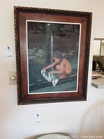 Framed acrylic painting showing full artwork of child washing at water tap in an outdoor setting.