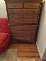 Front view of the Richardson Brothers wood dresser showing all drawers and metal handles.