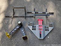 Photo showing two different styles of metal pull-up bars with padded grips and mounts for installation.