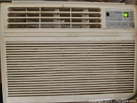 Front view of Daewoo window air conditioner with digital display showing temperature 78°F and visible wear