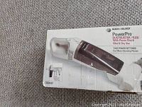 Black & Decker PowerPro DustBuster Plus DB5000 handheld vacuum in original box showing product image and model number.