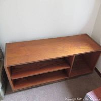 Full frontal view of the shelving unit showing overall form and finish