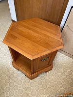 Top view of the hexagonal maple end table, showing the clean surface and wood grain.