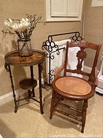 Overall view of armchair, table and towel rack arranged together