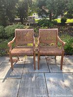 Front view of both chairs on flagstone patio
