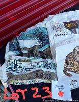 Three vintage calendar towels from 1973, 1974, and 1975 with calendar prints and illustrations.