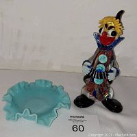 Photo showing both the Murano glass clown figurine and the blue Fenton hobnail plate together on a white surface.