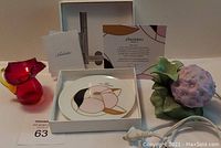 Photo showing all three items: Avon hydrangea oil diffuser night lite with floral design and power cord, amberina crackle glass mini pitcher, and Noritake Shiseido anniversary plate in box with certificates and stand.