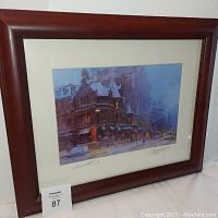 Framed watercolor print showing winter street scene in Boston with visible signatures and date.