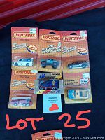Photo showing 6 vintage Matchbox toy vehicles in original sealed blister card packaging with visible front designs.