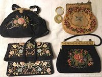Four vintage/antique beaded purses, three with floral embroidery and one with bird motif, plus small round mirror