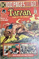 Front cover of Tarzan Lord of the Jungle comic book showing Tarzan fighting a lion with additional story titles.