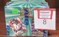 Sealed, shrink-wrapped box of 1994 Ultra Fleer football cards with visible label and graphics of football players on the packaging.
