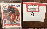 Front view of the 1989 Michael Jordan NBA All-Star Game card in protective casing.