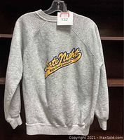 Full front view of grey sweatshirt with Late Night with David Letterman logo on chest.