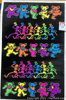 Full view of the black velvet poster showing colorful fluorescent teddy bears and skeletons dancing across the black velvet surface.
