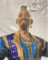 Close-up of the upper body and face of the Will Smith Genie cardboard cutout showing detailed costume and facial features.