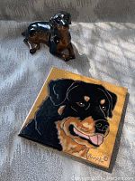 Signed porcelain hanging tile with Rottweiler face painting, signed 'Pumpkin'