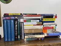 Books arranged showing a variety of titles and genres including history, literature, and plays.
