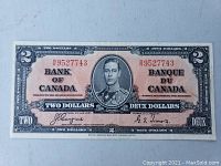 Front view of 1937 Canadian two-dollar note, clearly showing King George VI portrait, serial number, and signatures.