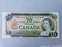 Full front view of the 1969 Canadian twenty dollar banknote showing complete note with serial numbers and Queen Elizabeth II portrait.