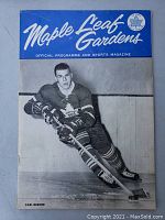 Front cover of the vintage hockey program showing Carl Brewer in full hockey gear with 'Maple Leaf Gardens Official Programme and Sports Magazine' title.