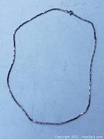 Image of a vintage elongated box chain necklace laid flat showing the full 19-inch length and spring ring clasp closure.