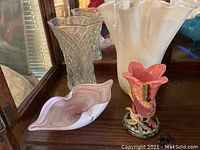 Full group photo showing three Murano glass vases and two sea shell bowls on a wooden surface