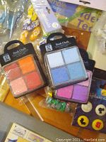 Three different color sets of GellyRoll chalk ink pads in original packaging.