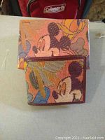 Photo of Disney Mickey Mouse wallet and matching box, showing woven colorful design with character artwork