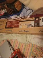 Full box label showing the brand Z-line Designs and the product name Kensington Hutch Bahut Kensington, with product details and shipping label partially visible.