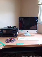 Overview of desk showing iMac, printer, keyboard, trackball mouse and mousepad