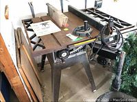 Full view of Craftsman table saw with miter gauge on the surface, showing saw body and legs.
