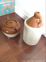 Bean pot and crock on hardwood floor showing full body and lid of pot