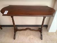 Full view of wood side table showing top and legs