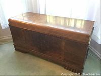 Closed front view of Lane cedar chest showing wood grain and finish condition