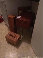 Wooden shoe shine box, two wood storage boxes, and small table together