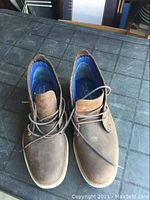 Top view of a pair of brown Mark Nason Skechers men's shoes showing overall condition and lacing.