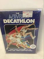 Front of sealed Activision Decathlon game box for Atari 2600 showing cover art of athletes and price sticker.