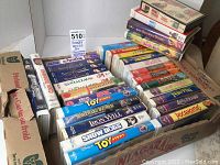 Photo showing multiple Disney VHS tapes stacked with visible titles like Toy Story, Snow Dogs, Honey, I Shrunk the Kids, and others.