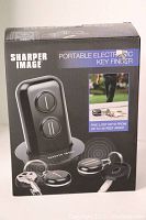 Product box of Sharper Image Portable Electronic Key Finder showing product images and branding.