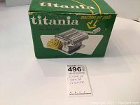 Titania pasta maker original green and white branded box with image of the pasta maker and pasta.