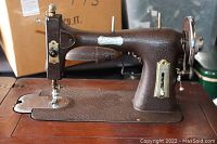 Front and side views of the vintage White Domestic metal sewing machine showing the sewing needle area, controls, and attached motor.