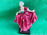 Antique Royal Doulton lady figurine 'Delight' full front view showing dress and bonnet details