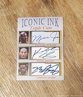 Front of the collectible card showing photos and facsimile autographs of Michael Jordan, Kobe Bryant, and LeBron James.