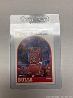 Front view of the 1989 NBA Hoops Michael Jordan trading card in protective sleeve.
