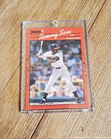 Front photo of 1990 Donruss Sammy Sosa baseball card showing player image and card details.