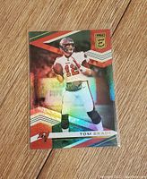 Front of the trading card showing Tom Brady in Tampa Bay Buccaneers uniform with a refractor shiny effect.