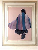 Full view of the framed print showing the person walking, wrapped in a striped blanket from behind.