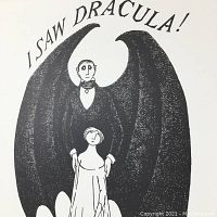 Front view of the Edward Gorey "I Saw Dracula" print, showing vampire figure with wings and woman below with title text above.